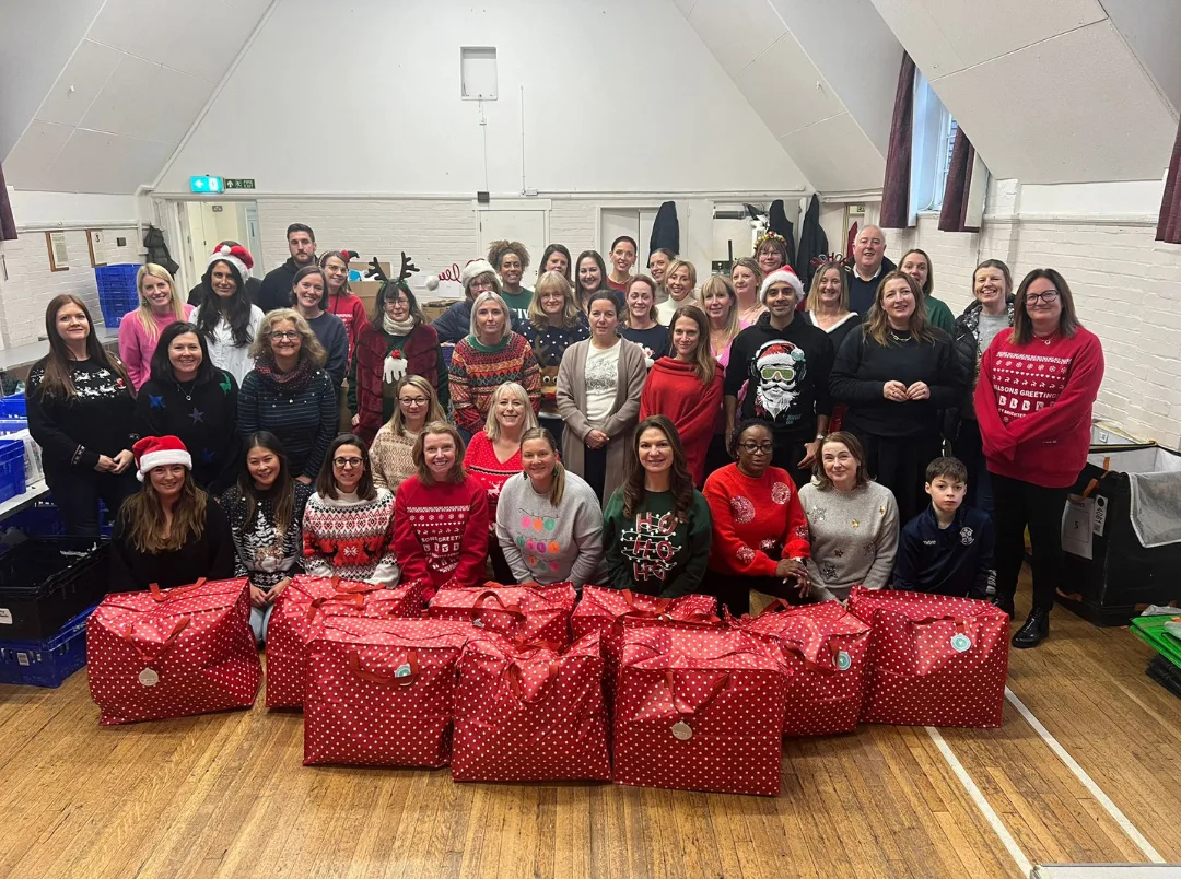 Bromley Brighter Beginnings volunteers with filled Christmas for Every Child bags