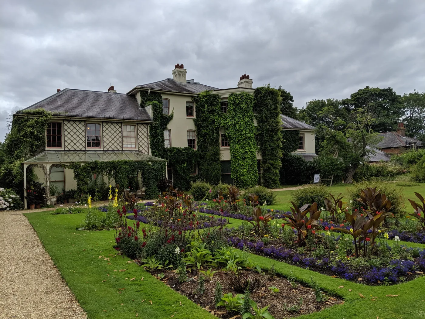 Down House, Charles Darwin's home in Downe, seen across the flower beds of its garden