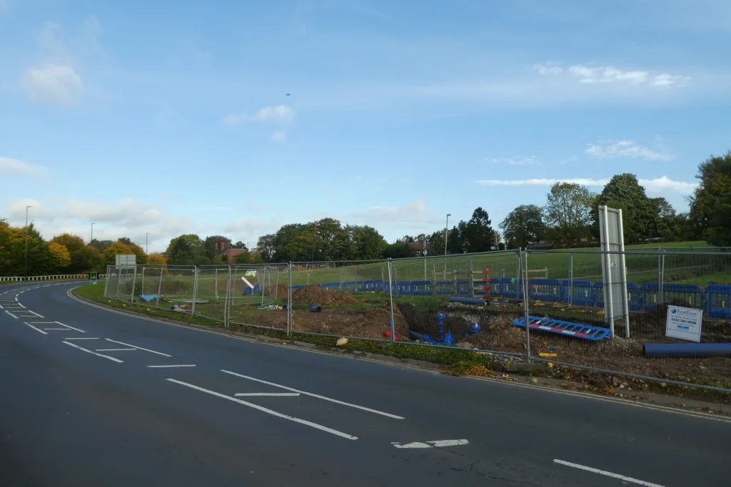 A water main replacement site, with the new pipe alongside the trench. The photograph was taken elsewhere in England and does not show the Bromley works.